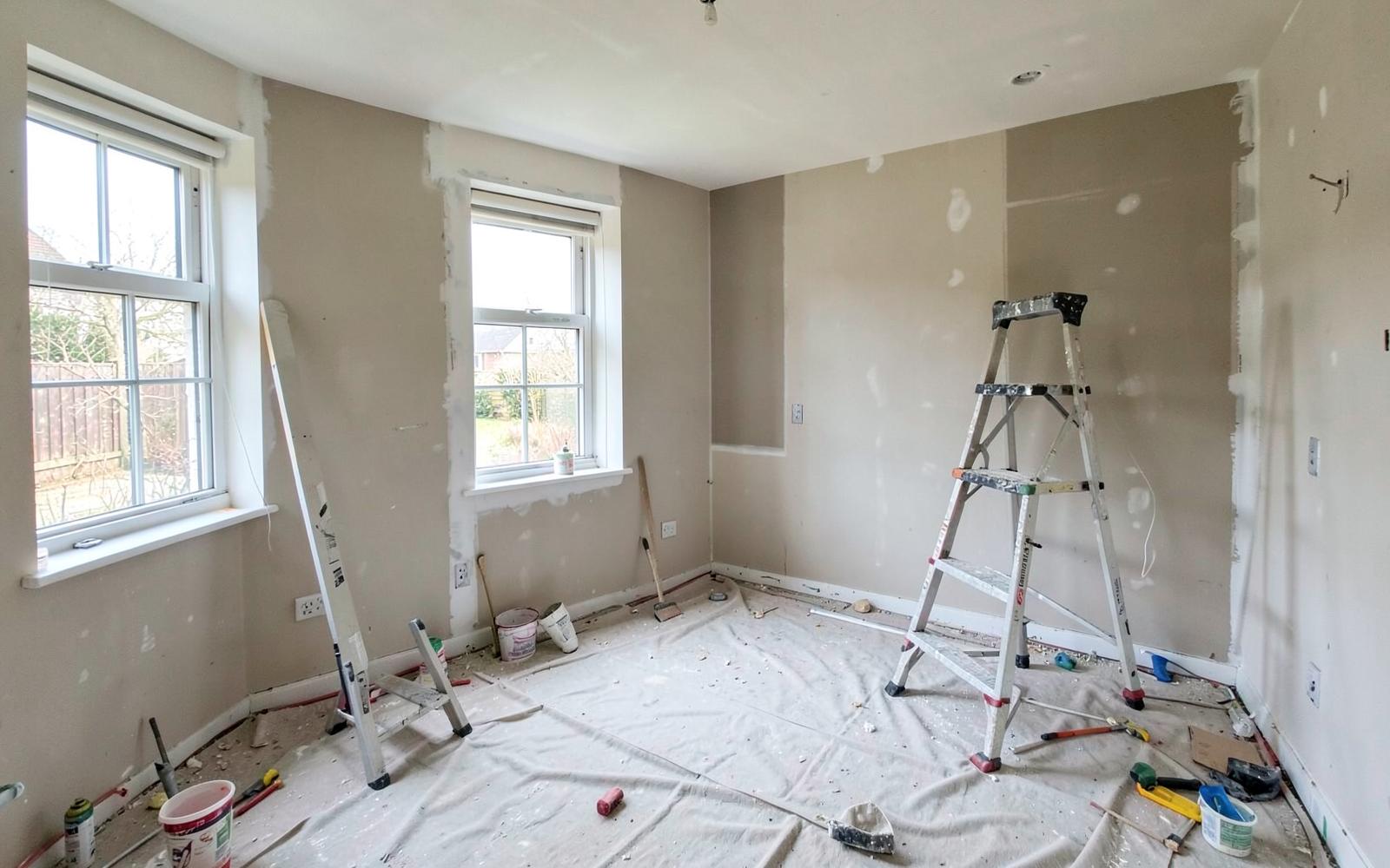 House undergoing refurbishment with new plasterboard and dust sheets